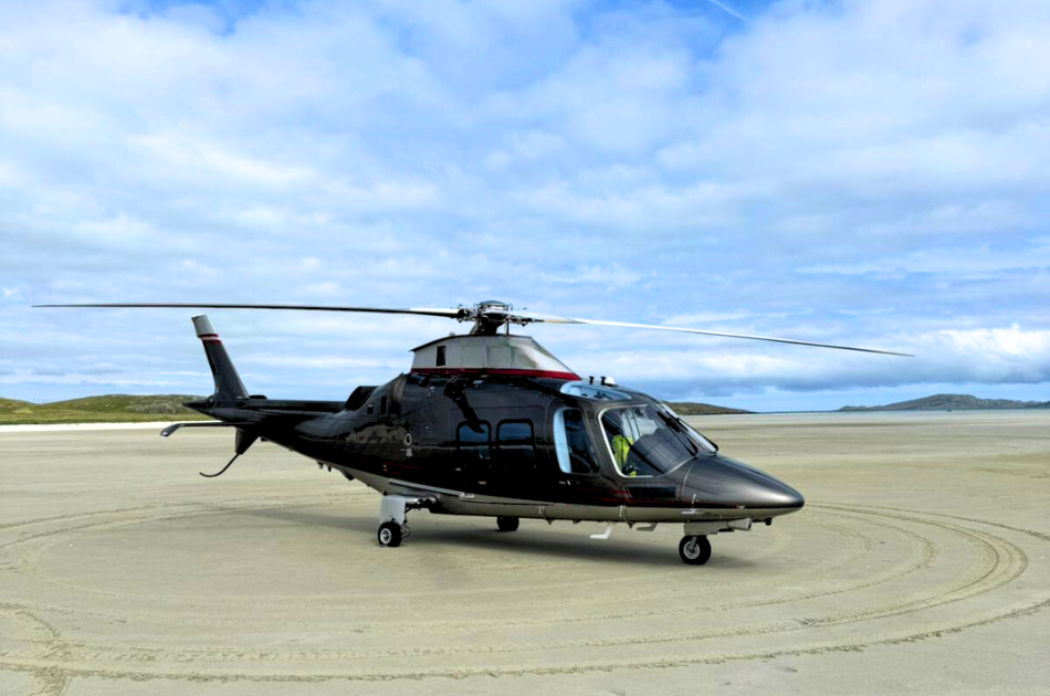 helicopter on sand at Barra Airport in Scotland