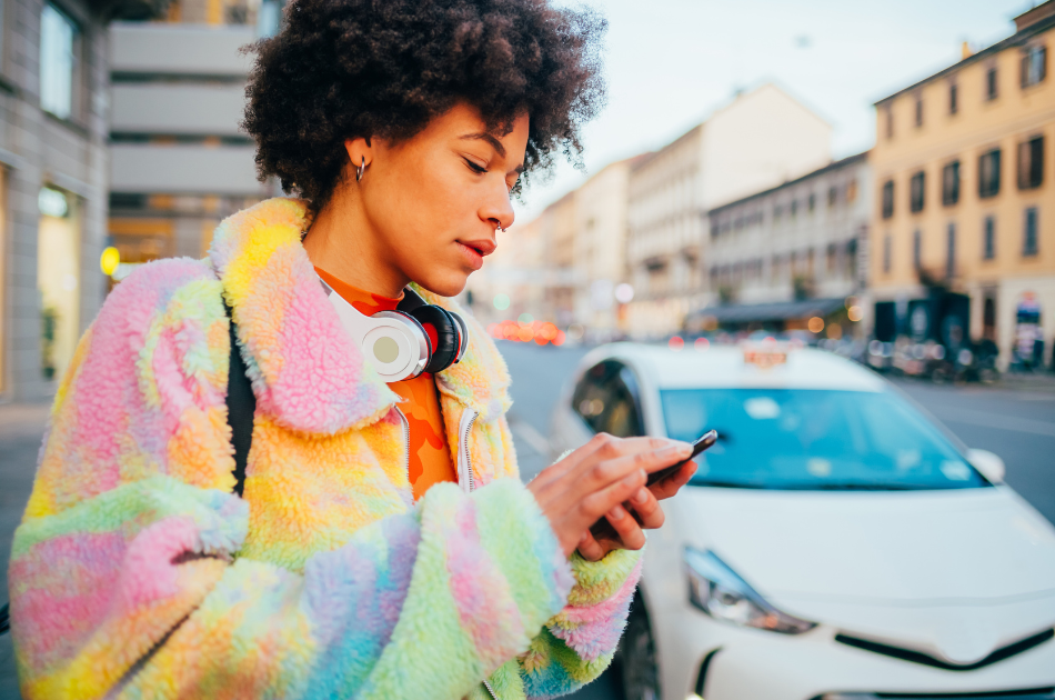 woman looking on mobile on the street in a city